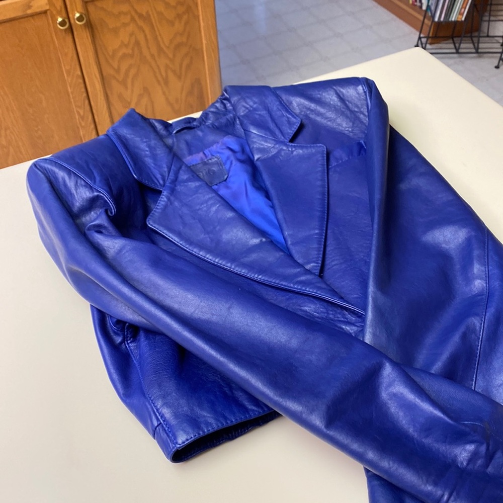 Purple bagatelle leather jacket cropped style. Single snap enclosure .